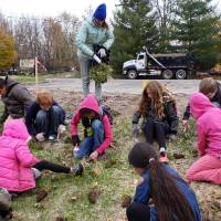 Lee Elementary students planting native plants
